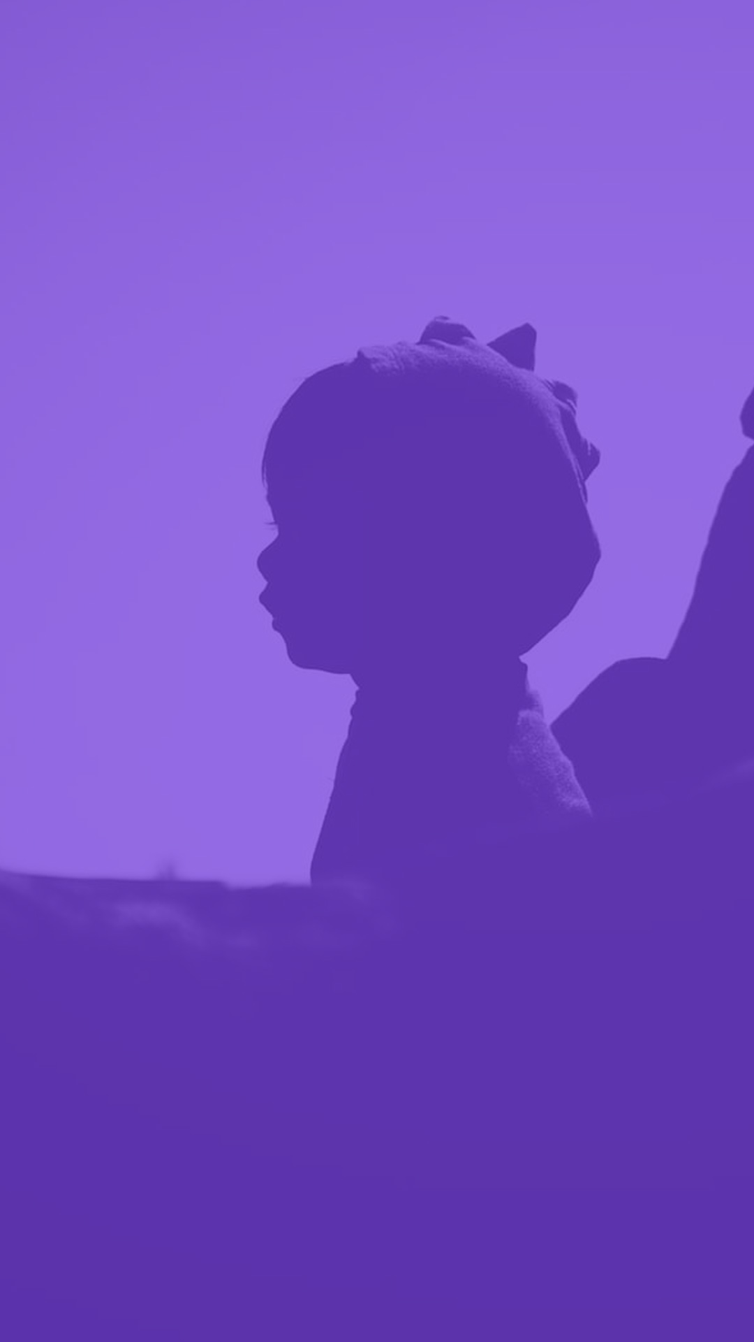 Silhouette of a child against a solid purple background, head turned to the left, highlighting profile and hat with small animal-like ears.